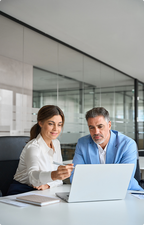Business colleagues reviewing project information together in an office