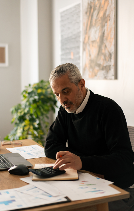 Business professional reviewing financial data and calculations