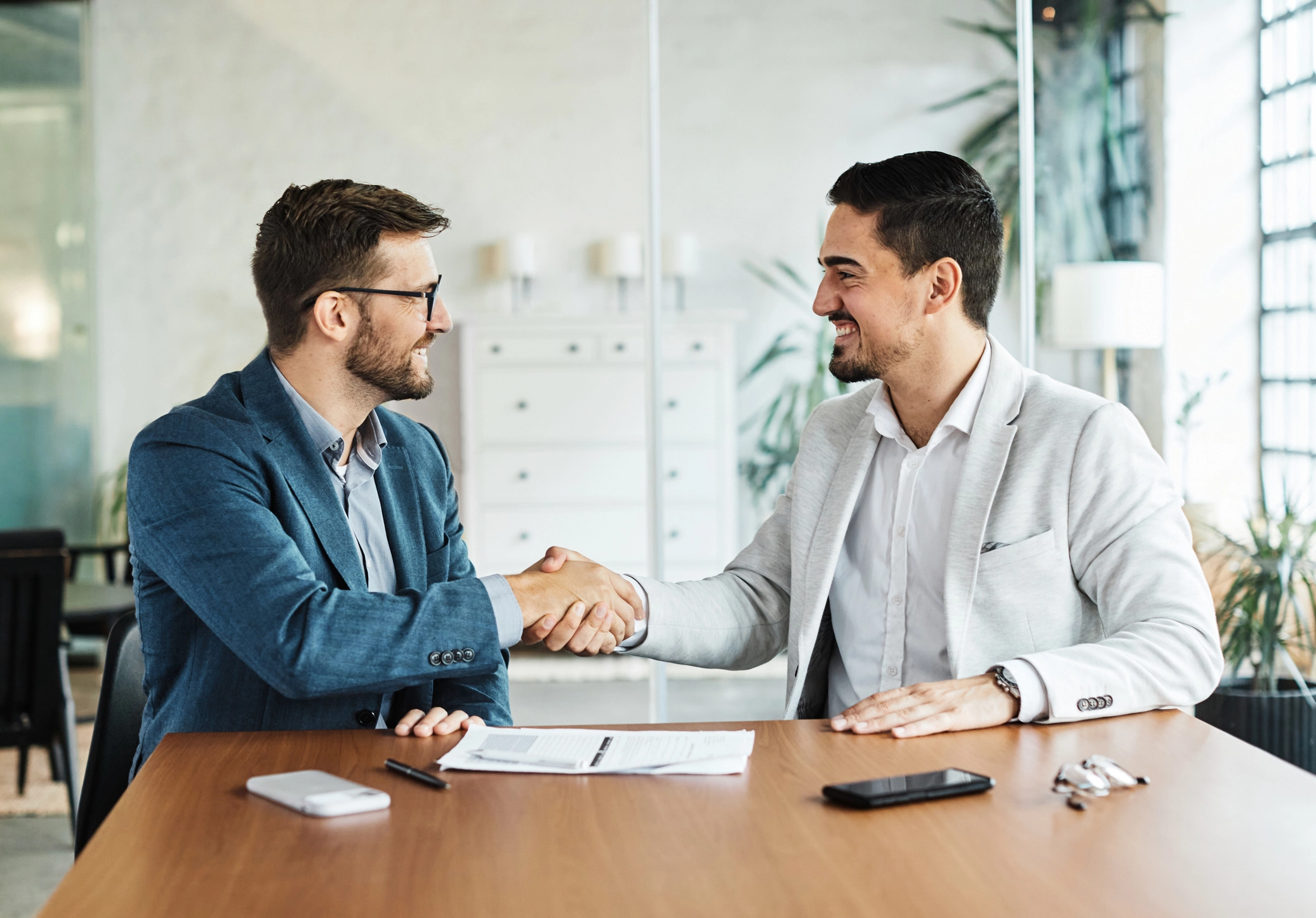 Business professionals shaking hands during a partnership