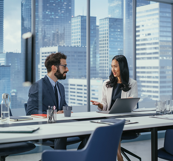Business professionals discussing ideas in a modern office