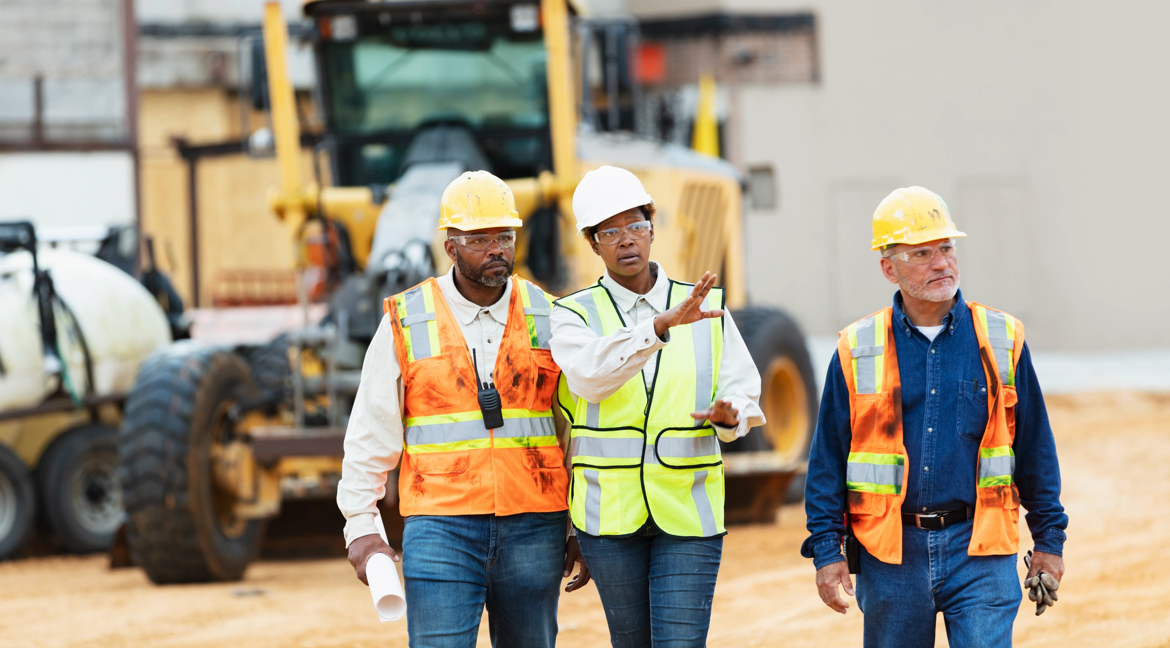 Construction professionals collaborating on a project site