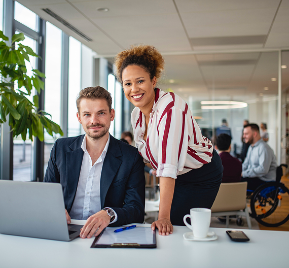Diverse professionals working together on a project in an office