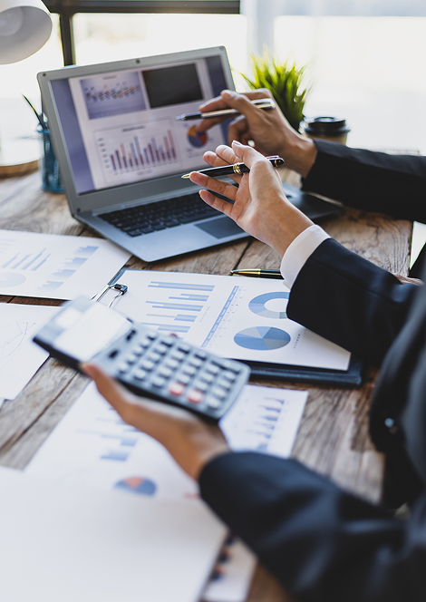 Professionals analyzing financial data and business reports