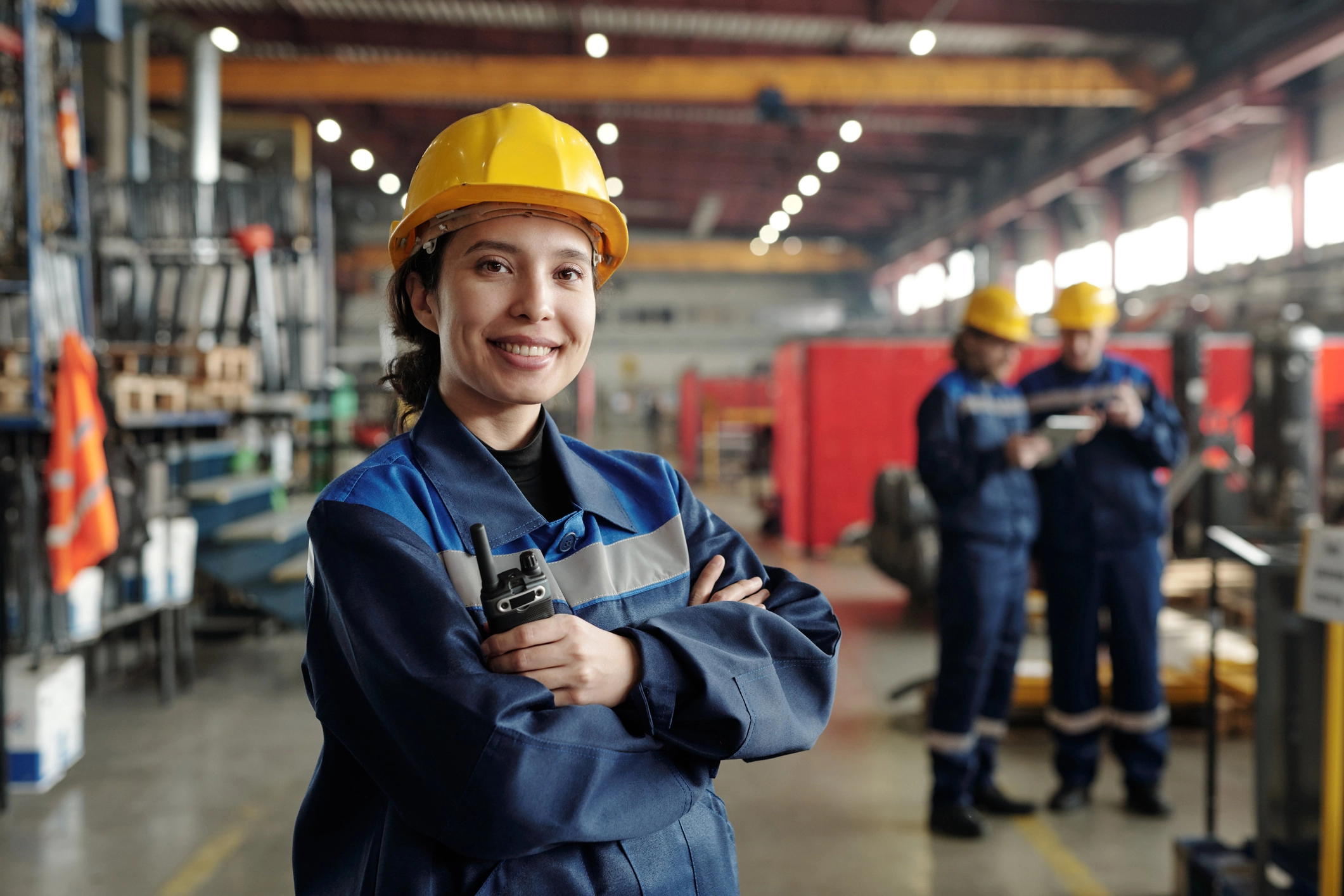 Industrial worker in protective gear at a manufacturing facility