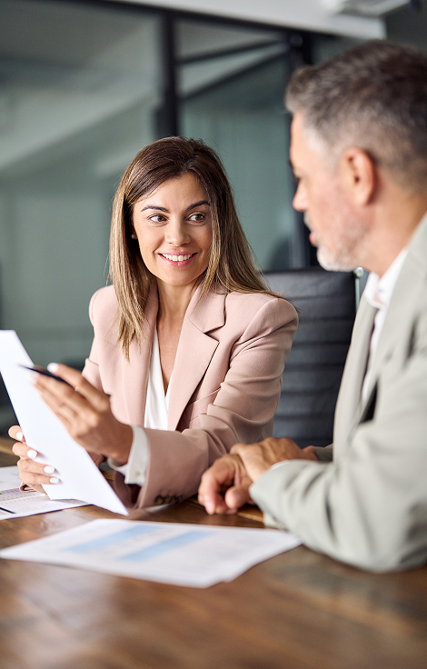 Professionals discussing documents during a consultation