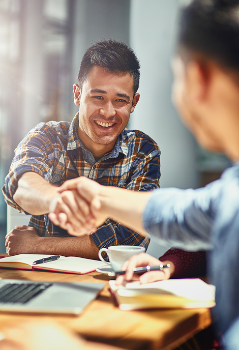 Professionals shaking hands during a business agreement