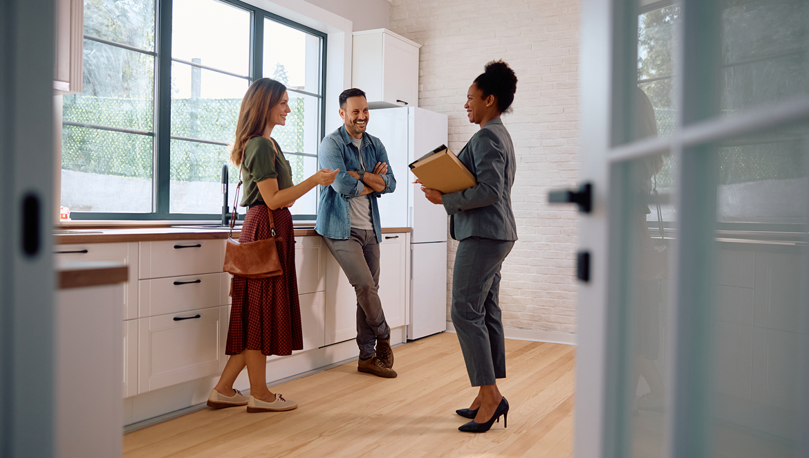 Real estate professional discussing home buying with clients